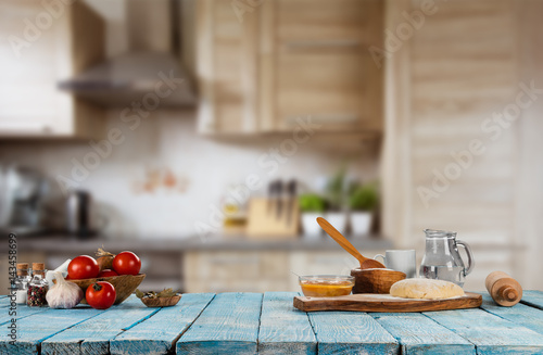 Baking ingredients placed on wooden table