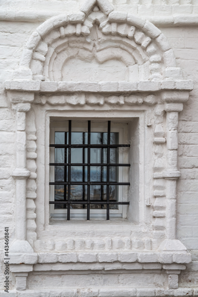 Window with bars in the Orthodox Church of white washed brick. Space to insert text Window with bars in the Orthodox Church of white washed brick. Space to insert text