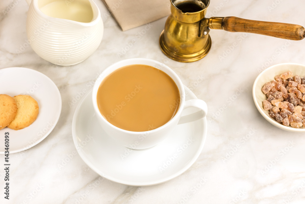 Cup of coffee with milk, butter cookie and milk jar Cup of coffee with milk, butter cookie and milk jar