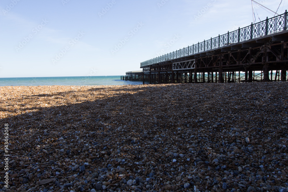 beach with side view of a pier
