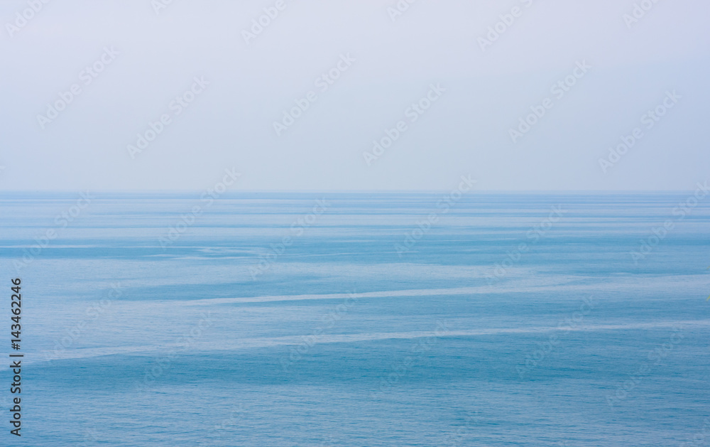 Blue clean sea or ocean and clear sky background