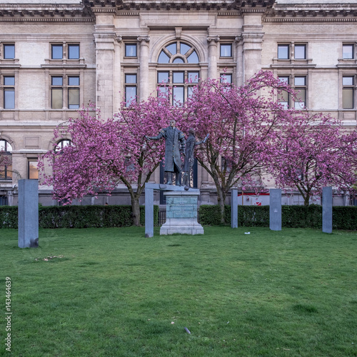 Statues and blossem behind the museum of fine arts in Antwerp, Belgium. photo