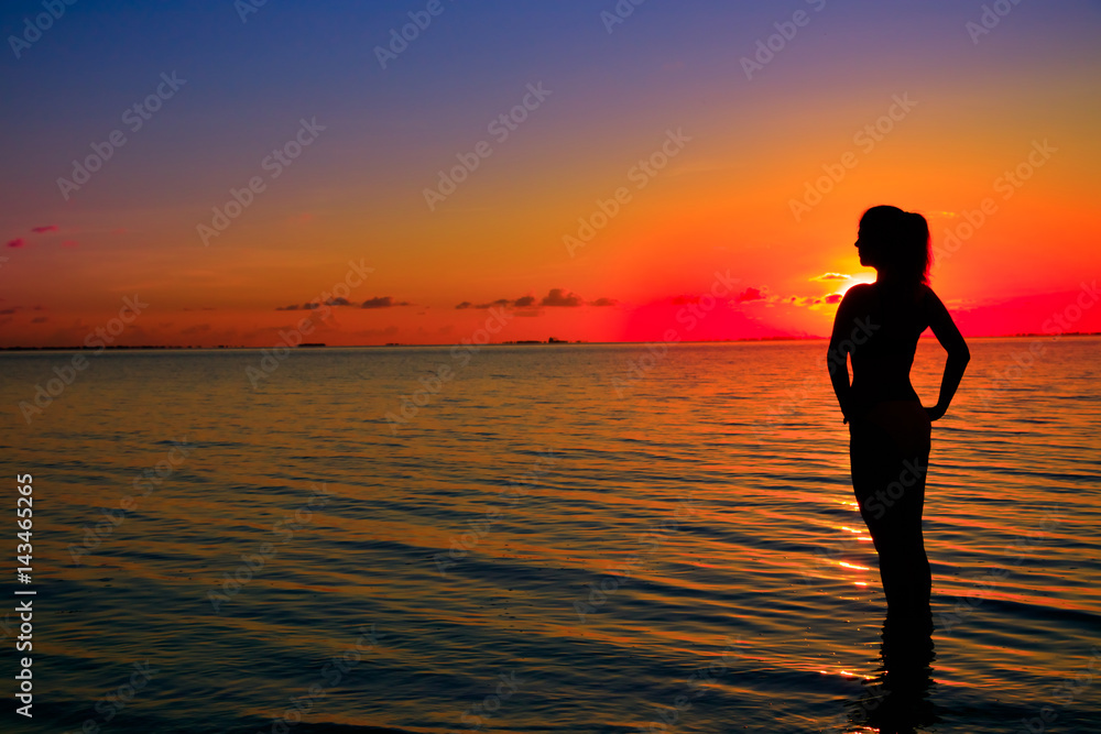 Woman silhouette on water