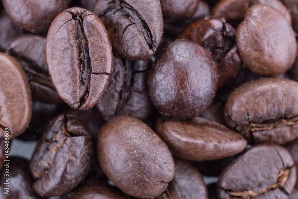 Grain coffee close-up, top view, macro, white isolated background Grain coffee close-up, top view, macro, white isolated background