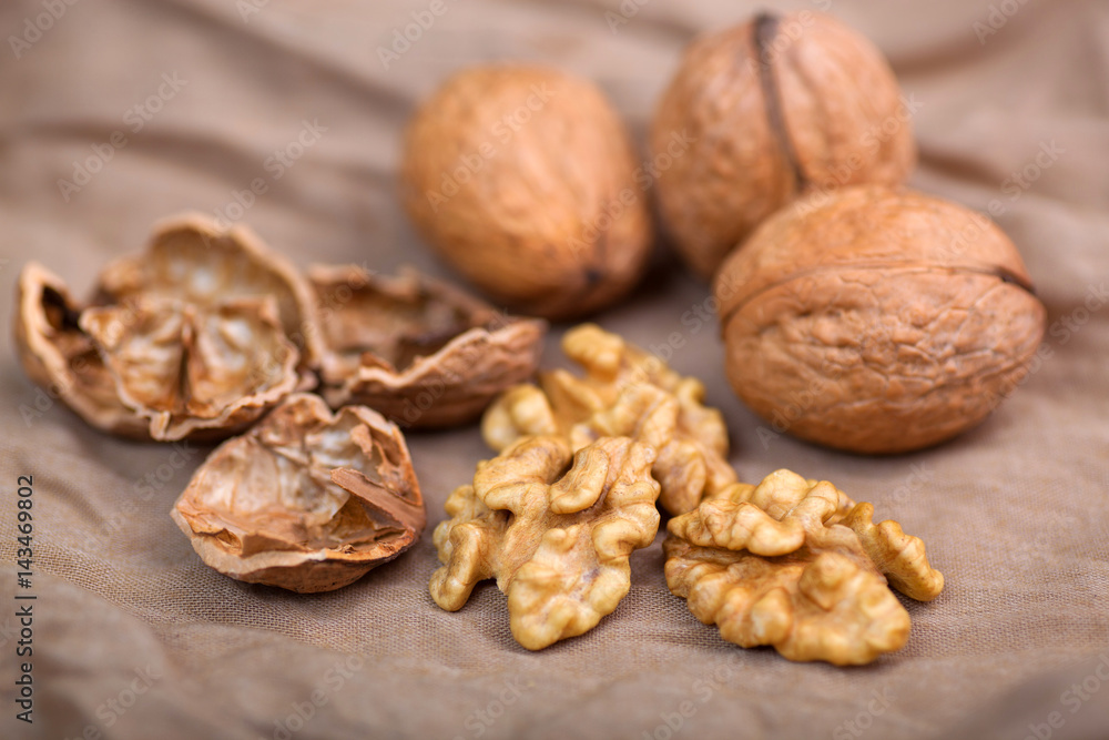 Walnut without shell close-up, and nuts in the shell Walnut without shell close-up, and nuts in the shell