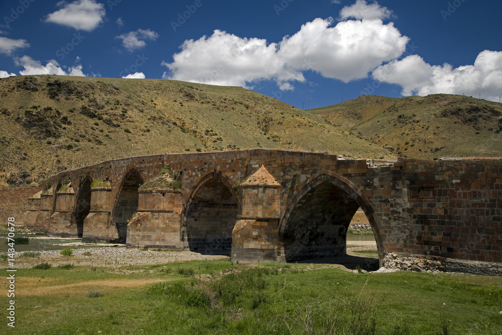 Historical Cobandere Bridge built in 1298 on Aras River, Kars Turkey.