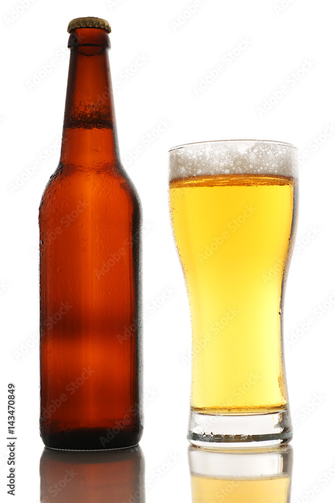 Bottle and a glass of beer with foam isolated on white background Bottle and a glass of beer with foam isolated on white background