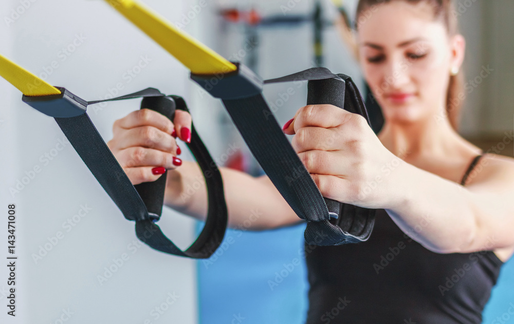 Woman Doing Barre + TRX Workout Woman Doing Barre + TRX Workout