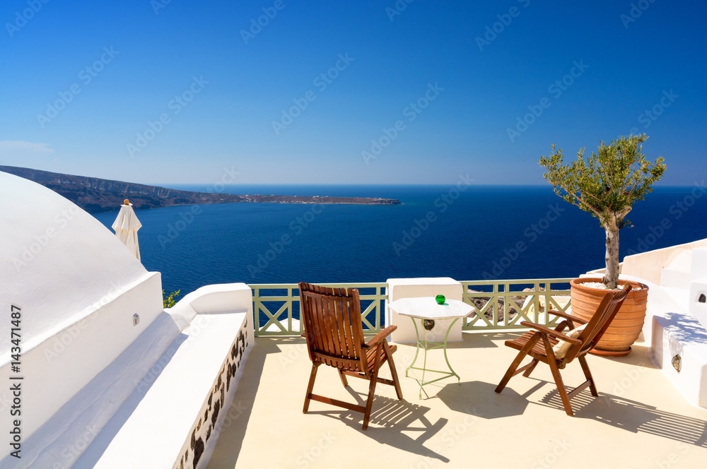 terrace with view on aegean sea in Oia village Santorini island, Cyclades, Greece