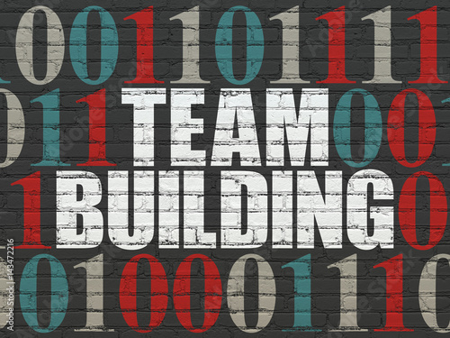 Finance concept: Team Building on wall background