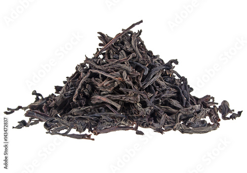 Slika na platnu Dry black tea leaves isolated on white background