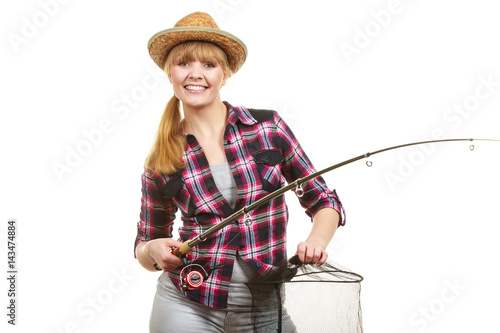 Happy woman holding fishing rod and keepnet photo