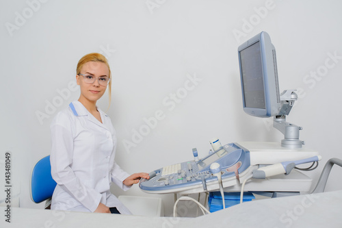 doctor working at ultrasound diagnostic machine