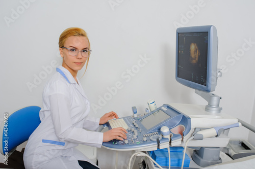 doctor working at ultrasound diagnostic machine