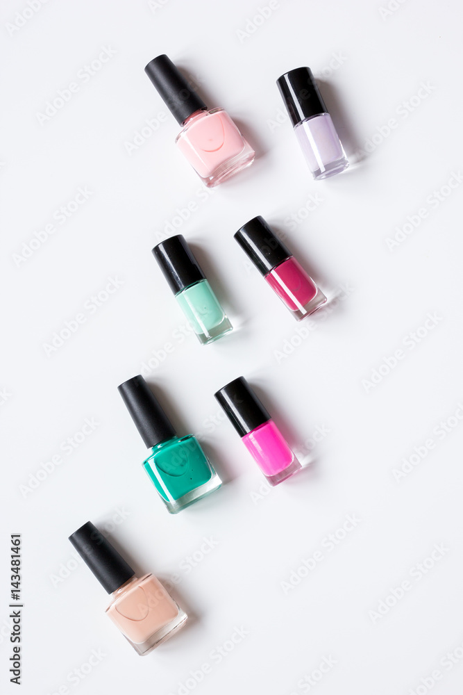 Close up of nail polish white background top view space for text Close up of nail polish white background top view space for text