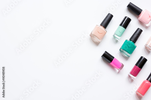hands care concept with nail polish white desk background top view mock-up