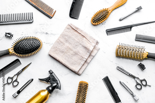 styling hair with tools in barbershop on white background top view