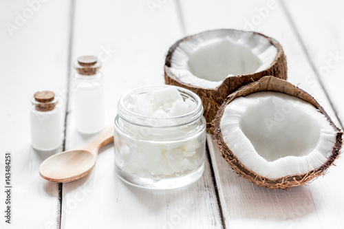 fresh coconut with cosmetic oil in jar on white background mockup