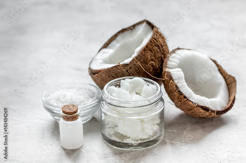 coconut oil for body care in cosmetic concept on white desk