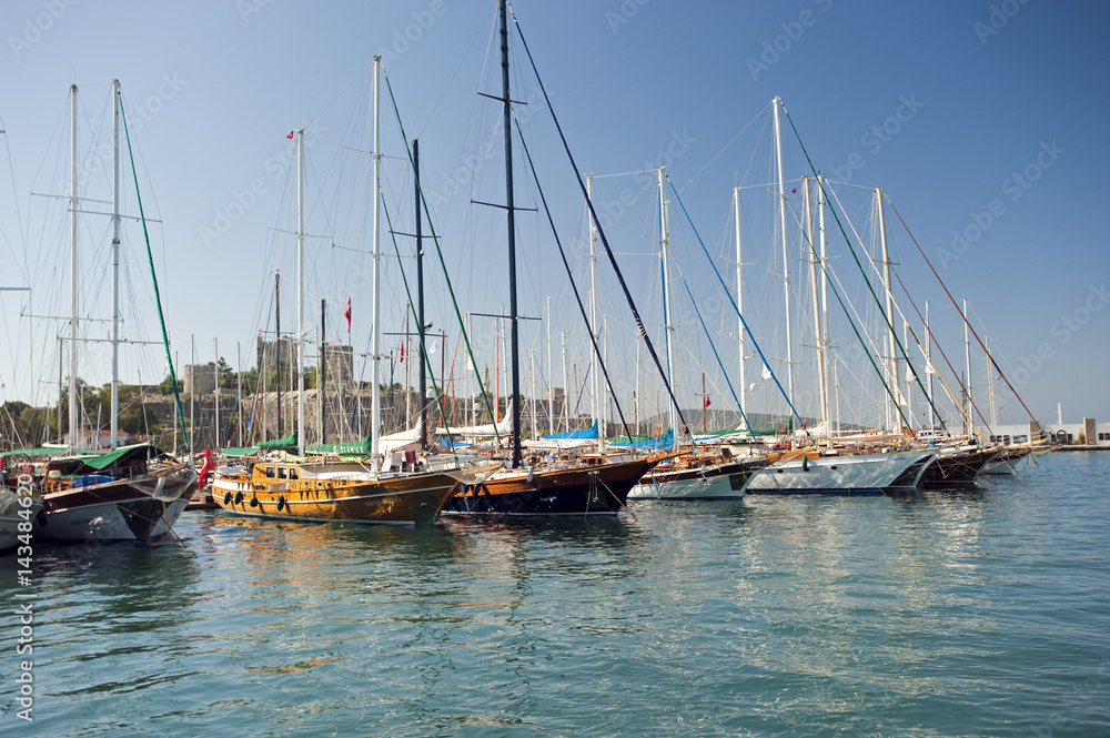 Bodrum harbor with traditional wooden boats and castle Turkey