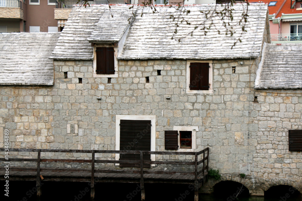 Traditional 17th-century watermill called 'Gaspina mlinica' on river Jadro in Solin, Croatia. Architectural detail.