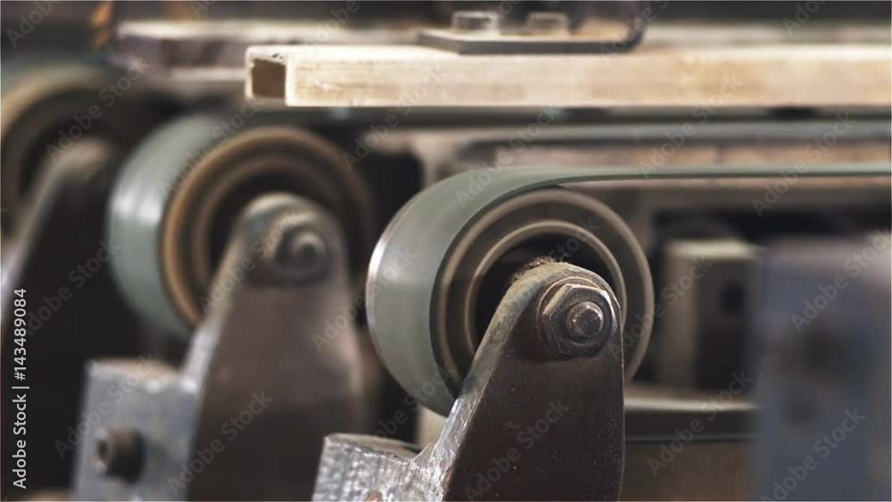 Detail from the printing press rotary dial that drive belts. Filmed from close range. Detail from the printing press rotary dial that drive belts. Filmed from close range.