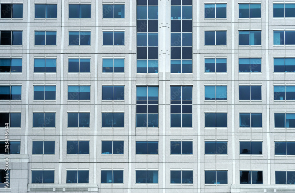 close up on facade view of glass windows in office building close up on facade view of glass windows in office building