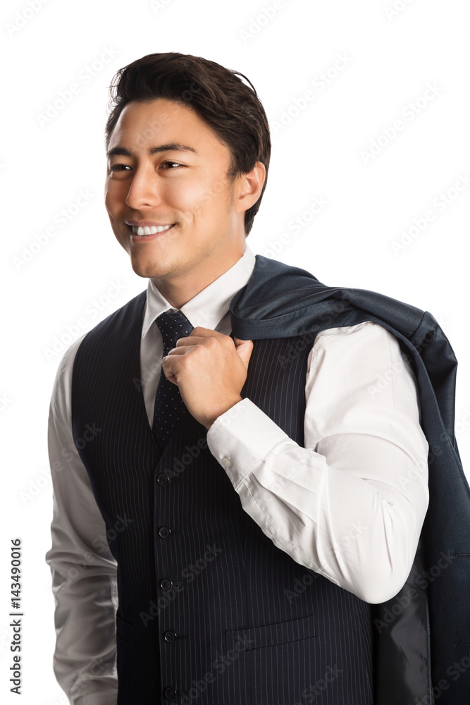 Fashionable businessman wearing a blue vest, tie and white shirt, standing with a smile against a white background. Fashionable businessman wearing a blue vest, tie and white shirt, standing with a smile against a white background.