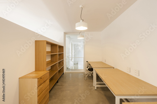 white empty office, showroom with pendant lighting, window., furniture.