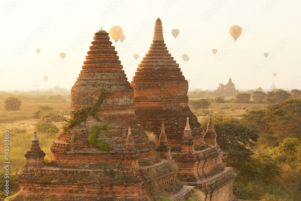 Epic sunrise scene among temples with hot air balloons in Bagan Myanmar 