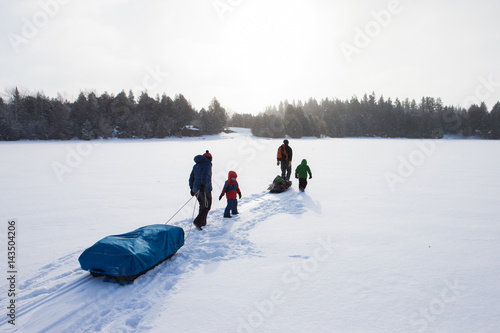 Obraz na płótnie Mixed race family going ice fishing w salonie