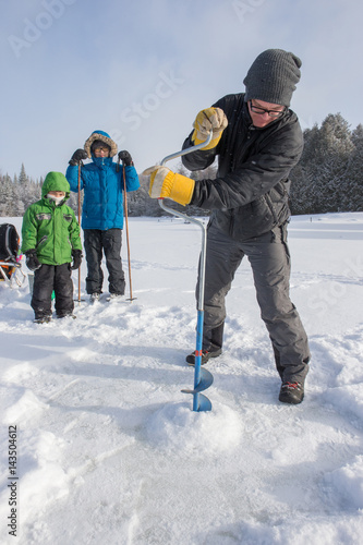 Obraz na płótnie Mixed race family ice fishing w salonie