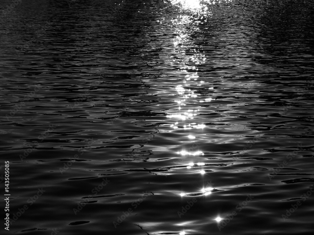 Fotografie water reflection texture background with light