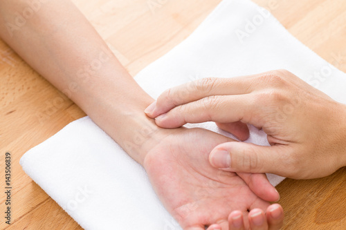 Wallpaper Mural Doctor checking patients pulse rate Torontodigital.ca