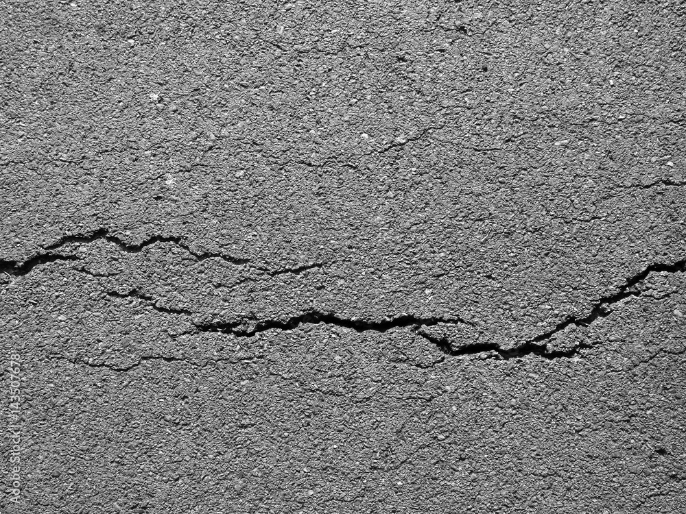 Obraz premium crack asphalt road background