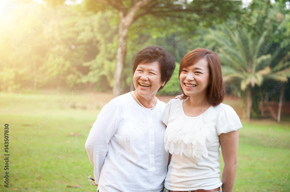 Asian elderly mother and grown daughter