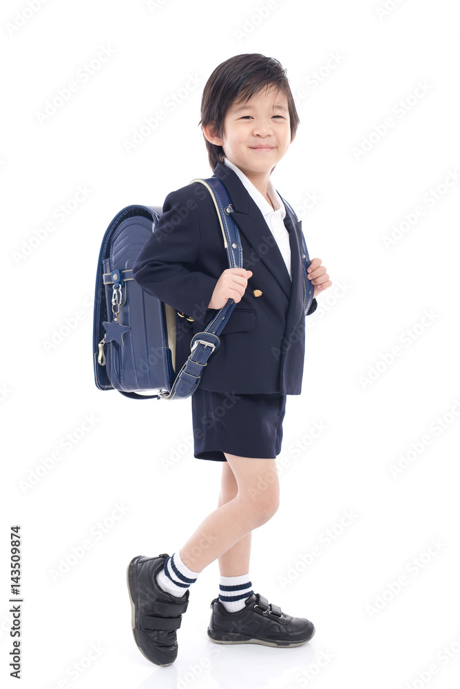 Asian child in school uniform with blue school bag Asian child in school uniform with blue school bag