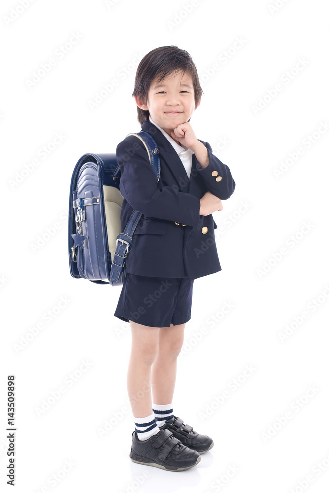 Asian child in school uniform with blue school bag Asian child in school uniform with blue school bag