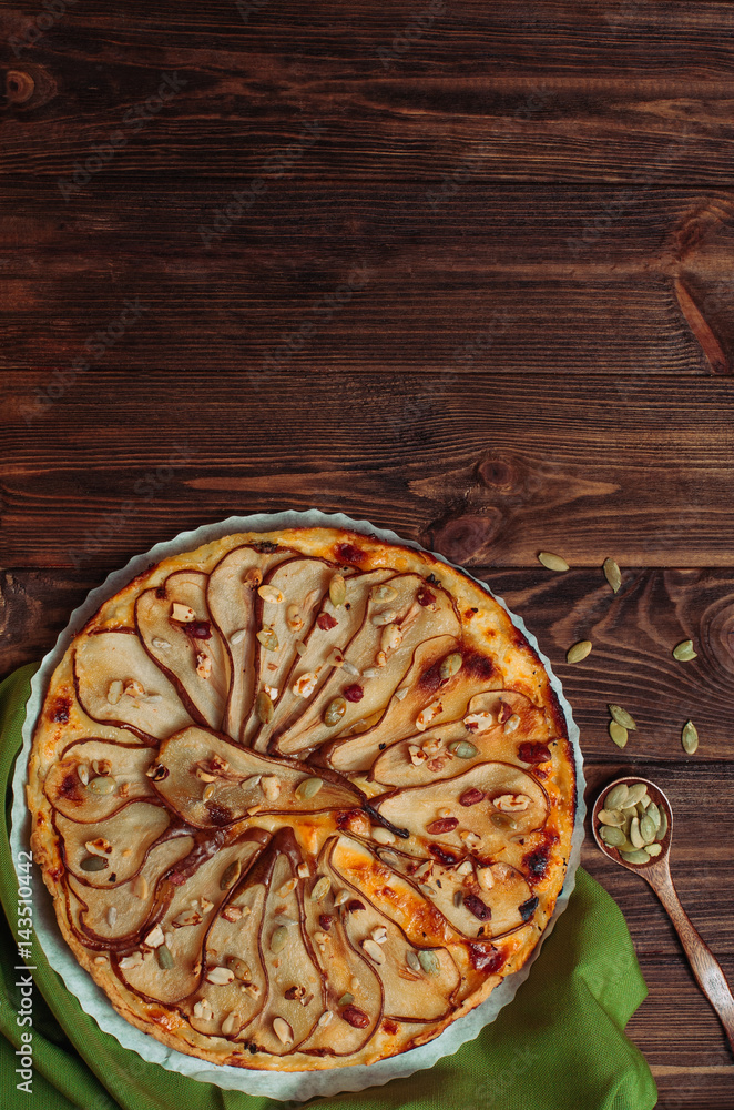 Top view of Pear tart with cheese on rustic wooden table with copyspace Top view of Pear tart with cheese on rustic wooden table with copyspace