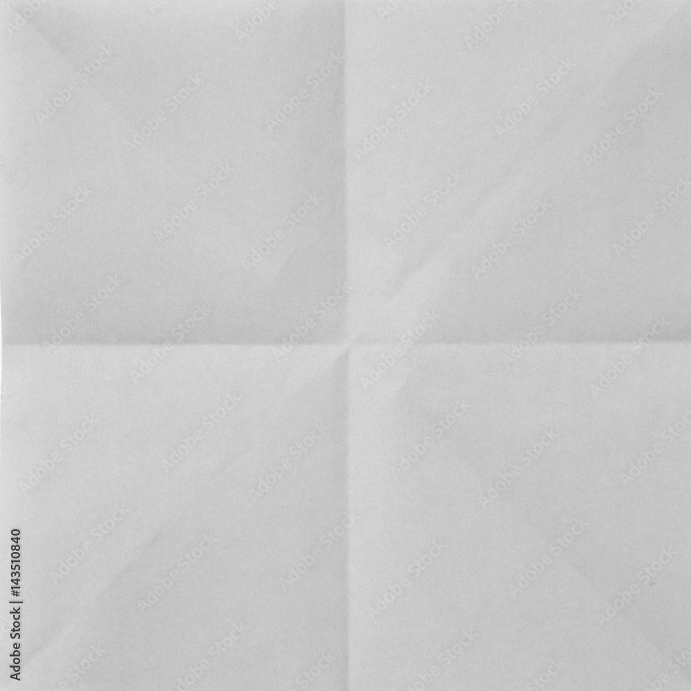 White sheet of paper folded in four White sheet of paper folded in four