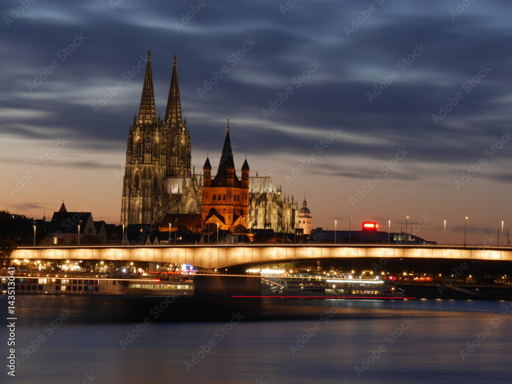 Cologne cathedral with bridge Severinsbruecke at night