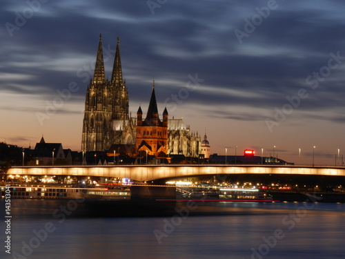 Cologne cathedral with bridge Severinsbruecke at night