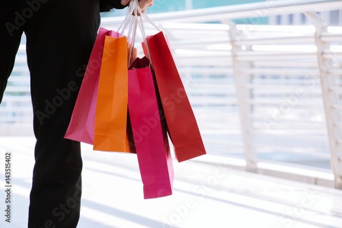 Man is carrying shopping bags