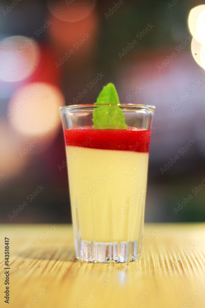 delicious dessert panna cotta in a glass and fresh strawberries delicious dessert panna cotta in a glass and fresh strawberries