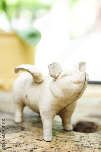 Small brocante pig statue in a vintage kitchen photo