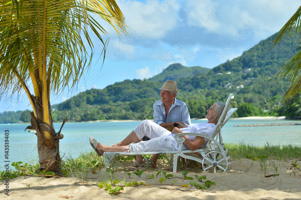 Elderly couple rest at tropical resort Elderly couple rest at tropical resort