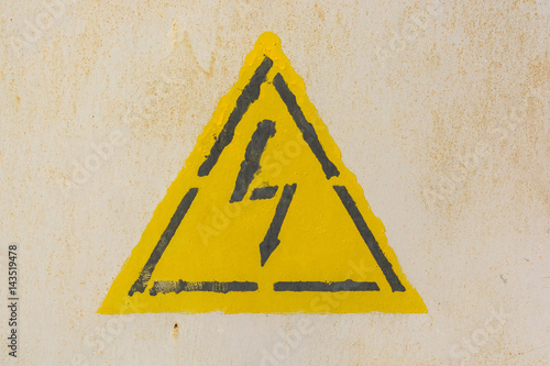 High voltage sign on grey wall