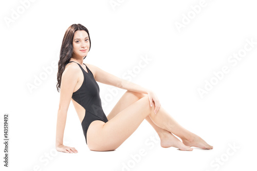 one young woman swimsuit, white background