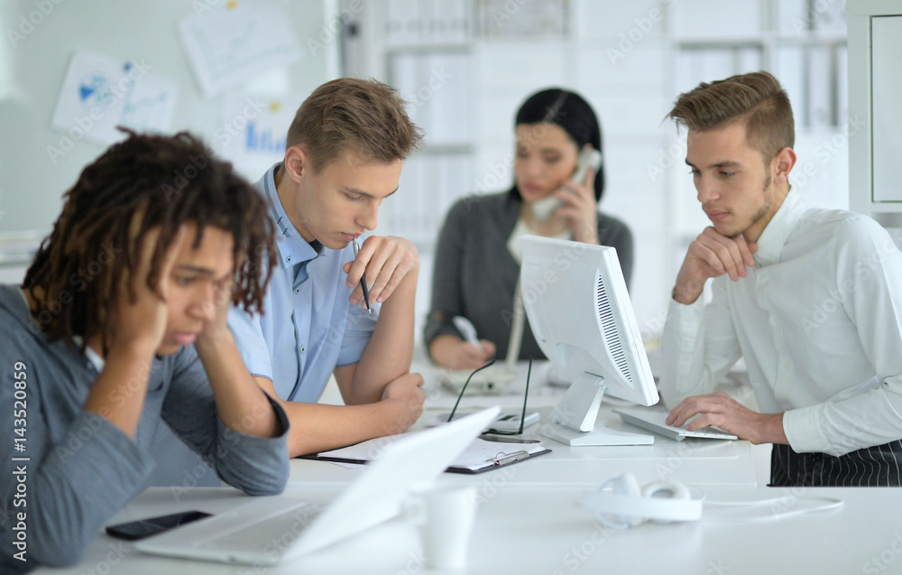 young people colleagues at office