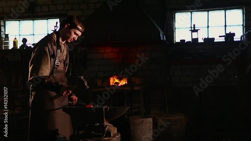 Wallpaper Mural The blacksmith forging the molten metal on the anvil in smithy. Torontodigital.ca